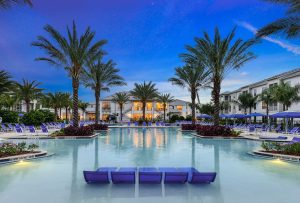 Resort facility with lounge chairs and palm trees