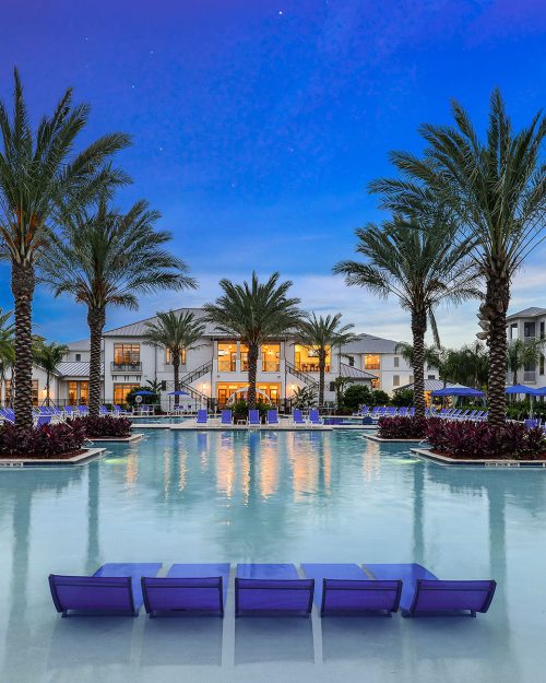 Resort facility with lounge chairs and palm trees