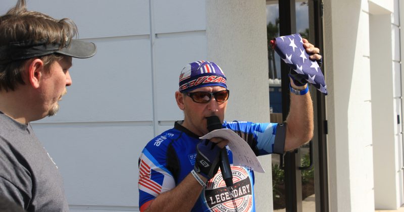 Steve Hughes photo with folded American flag