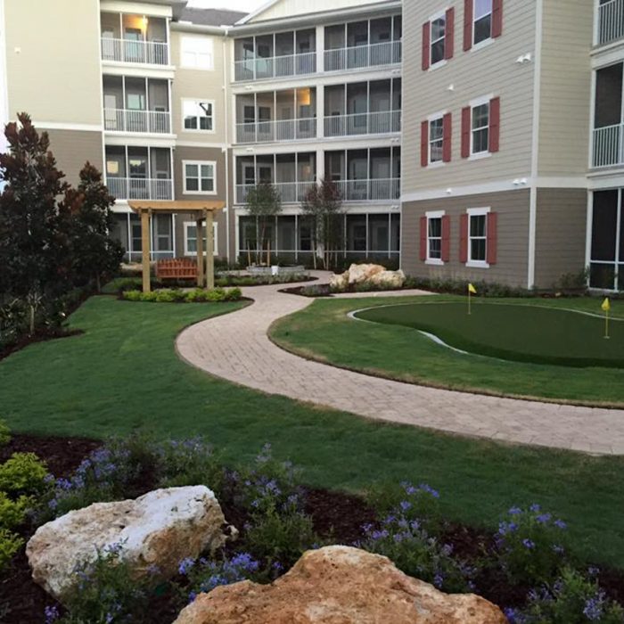 Monterey Pointe Market Rate Senior Living Apartments walking path in rear of building