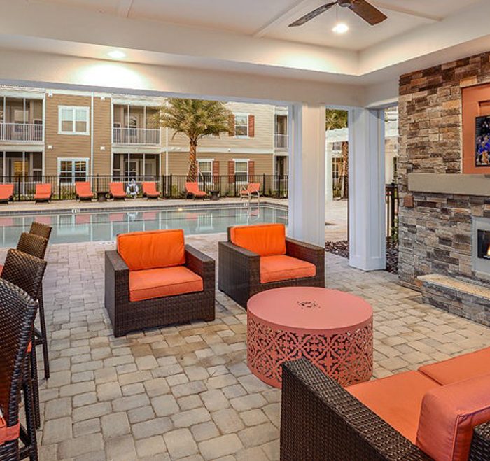 Monterey Pointe Market Rate Senior Living Apartments lounge area by pool