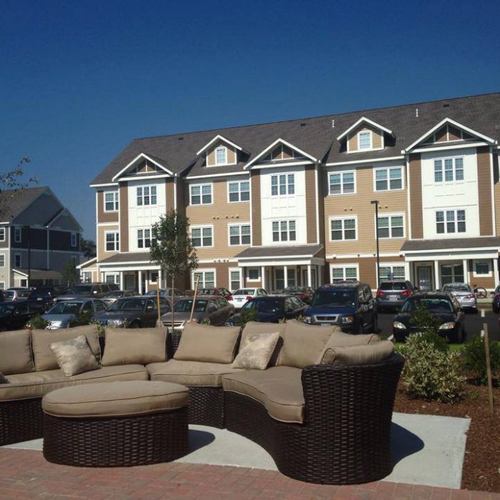 Multi story student housing with outdoor couch area