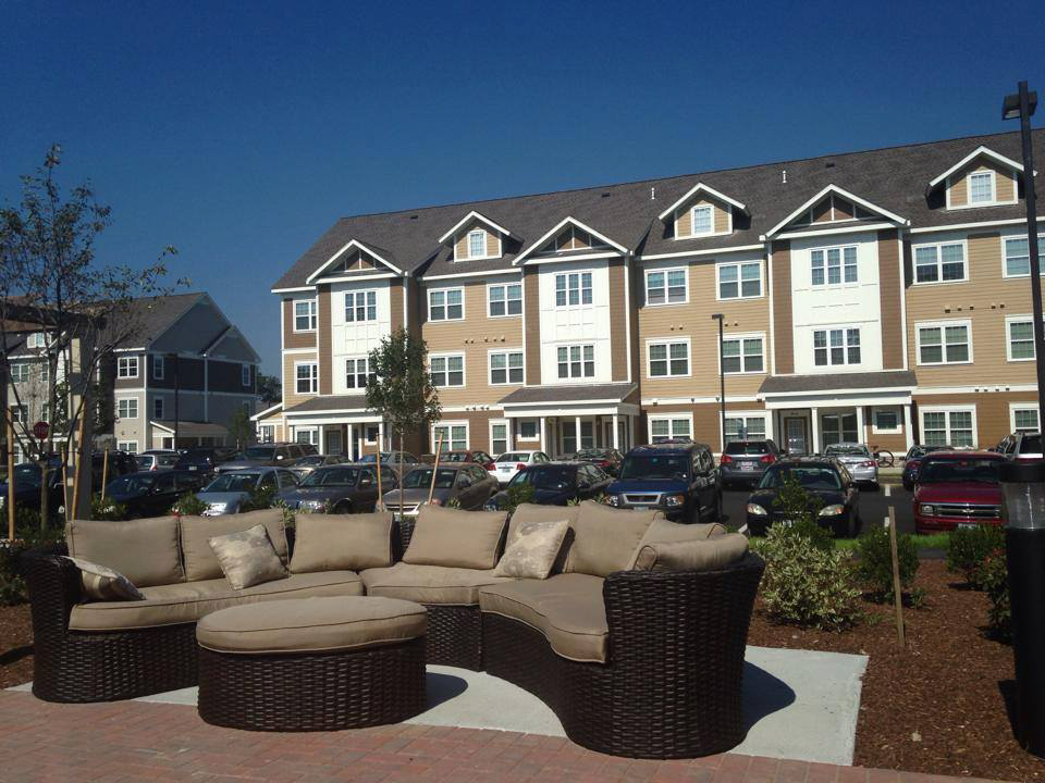 Multi story student housing with outdoor couch area