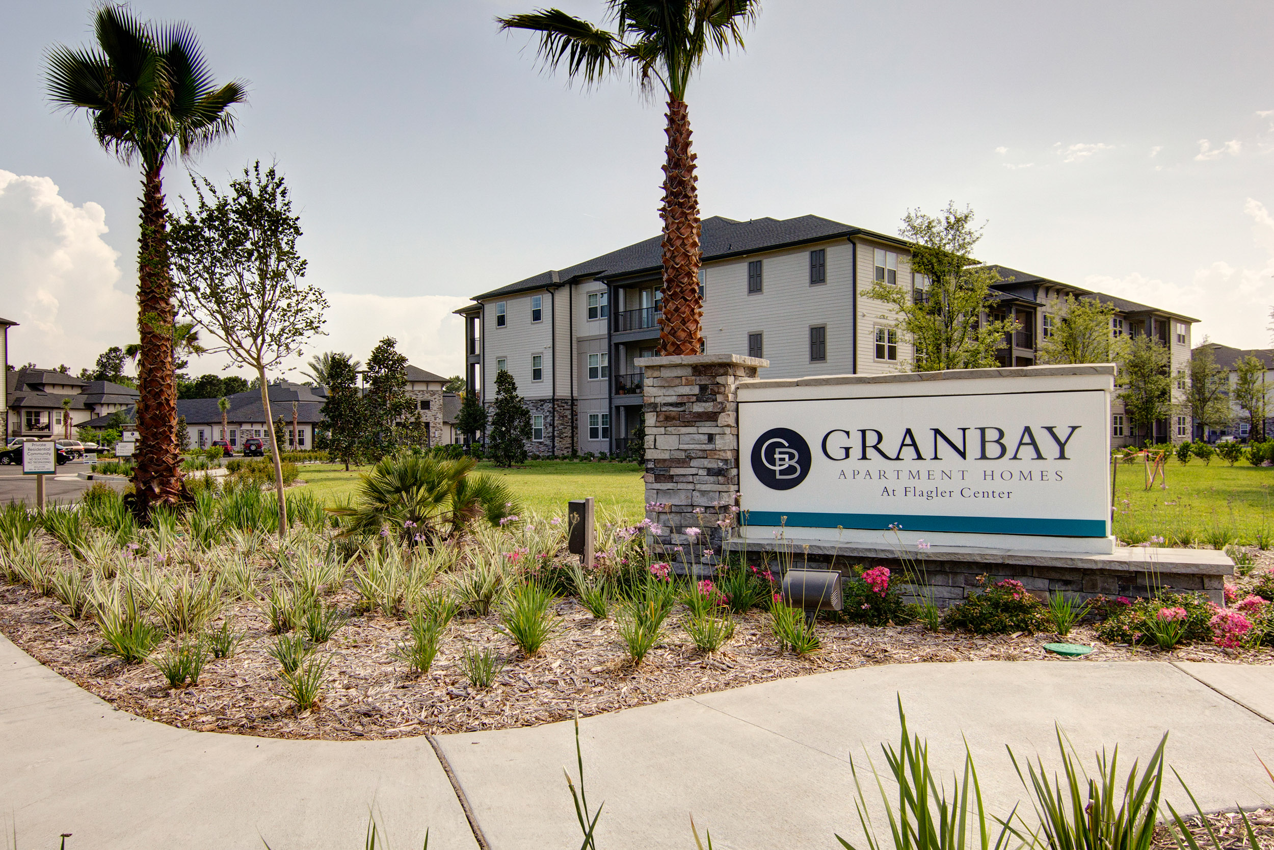 Multi story apartment complex with Gran Bay sign