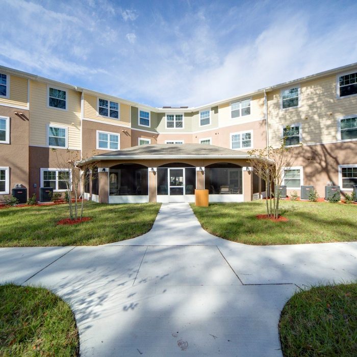 Multi story senior living facility courtyard entrance