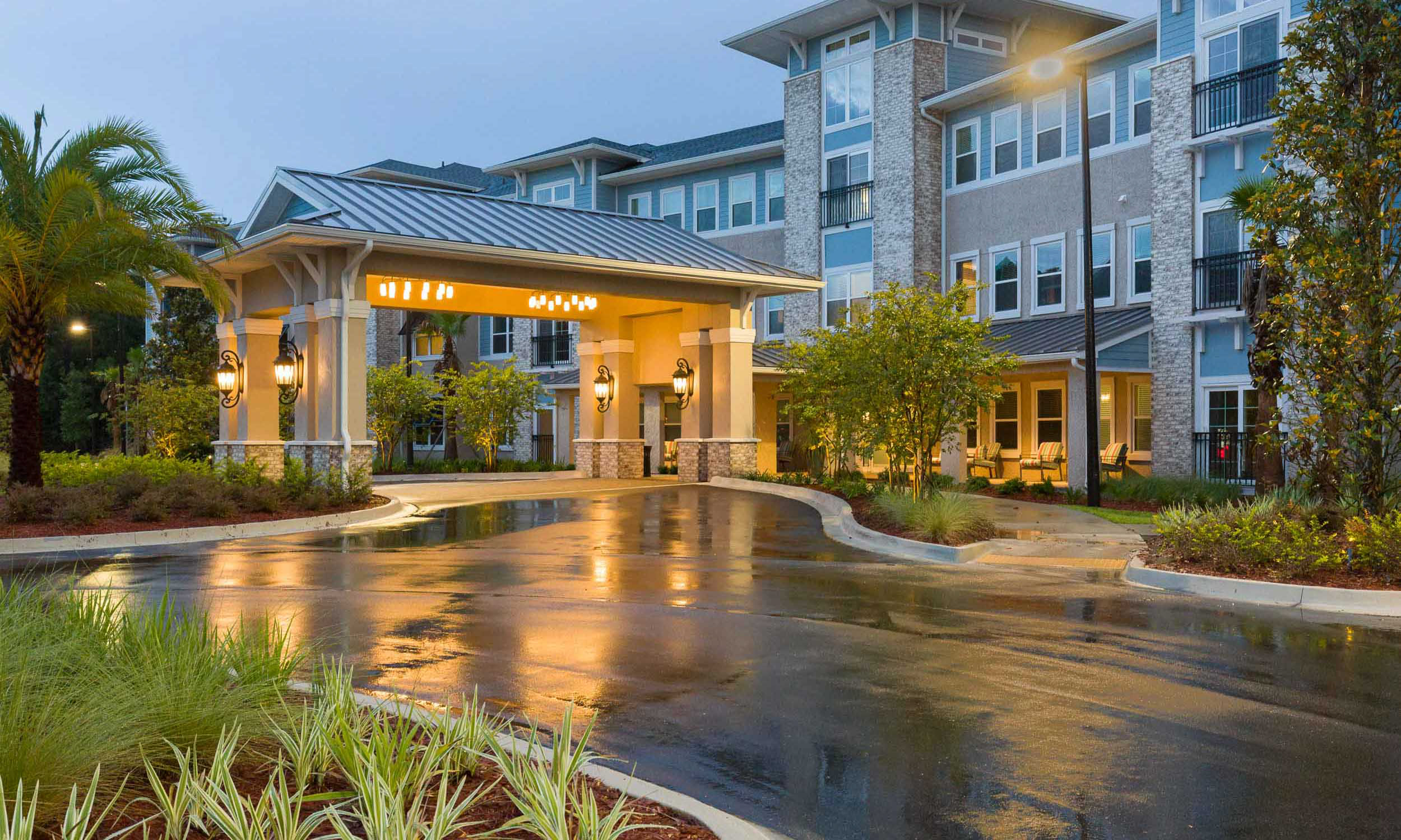 Senior living facility entrance at evening