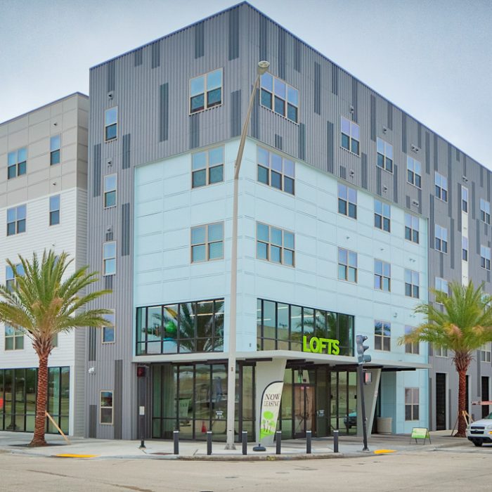 Multi story apartment complex front corner entrance