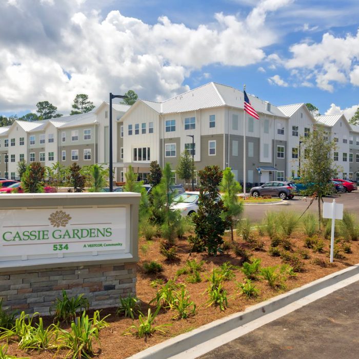 Multi story senior living apartments with Cassie Gardens sign
