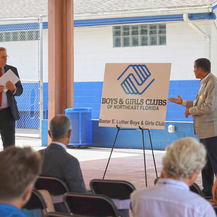 Man speaking to crowd for Boys & Girls Club Project by Summit Contracting Group
