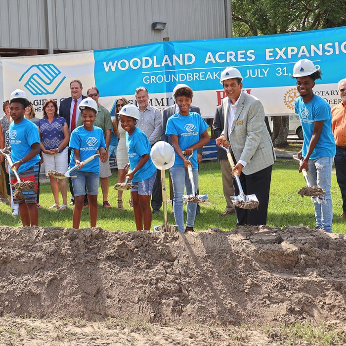 Kids posing with shovels for groundbreaking event at Boys & Girls Club Project by Summit Contracting Group