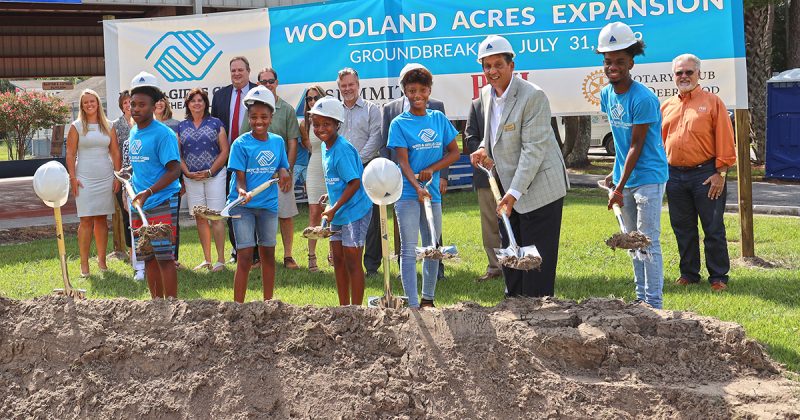 Kids posing with shovels for groundbreaking event at Boys & Girls Club Project by Summit Contracting Group