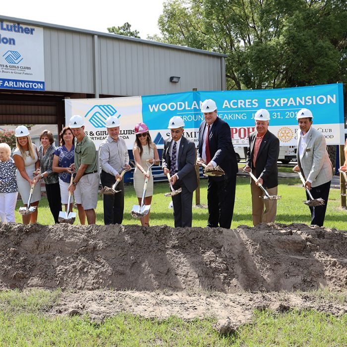 Contractors and executives digging into ground for new building development