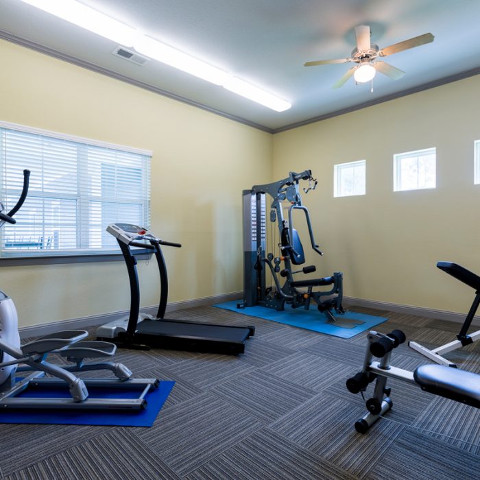Fitness room with equipment at K9s For Warriors Project by Summit Contracting Group