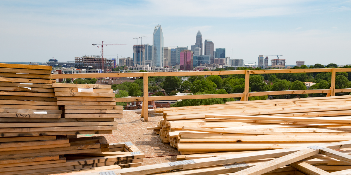 view of Charlotte skyline with lumber in foreground