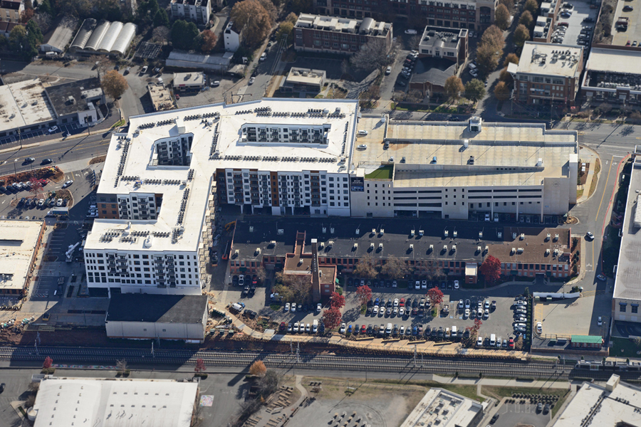 aerial view of Novel Atherton Mill stack, large building and parking garage