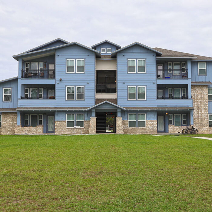 Woodland Park blue 3 story apartment building