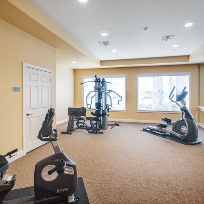 Fitness Area with equipment for Madison Crossing Market Rate Senior Living Apartments by Summit Contracting Group