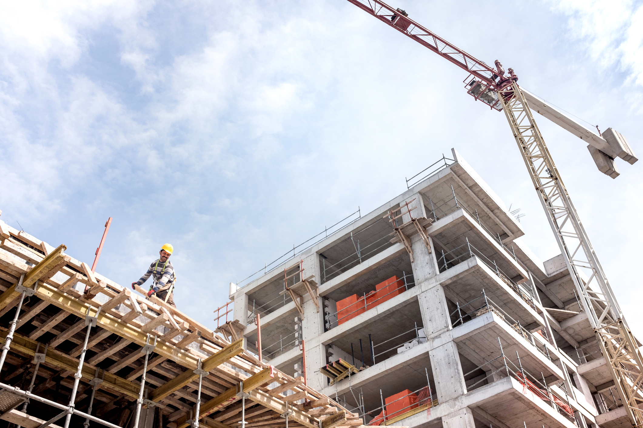 Construction site photo with worker