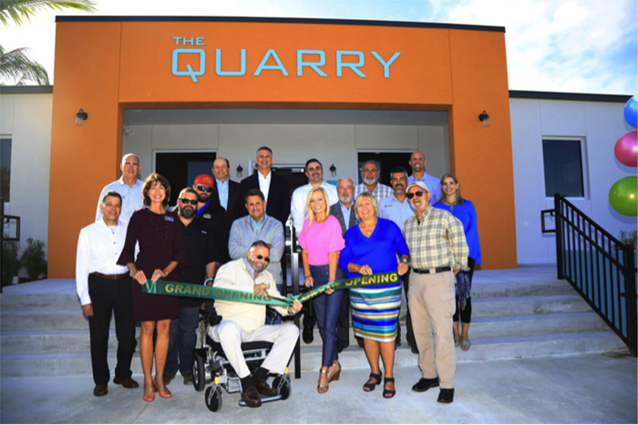 Group photo of opening event at The Quarry Affordable Workforce Housing Development by Summit Contracting Group