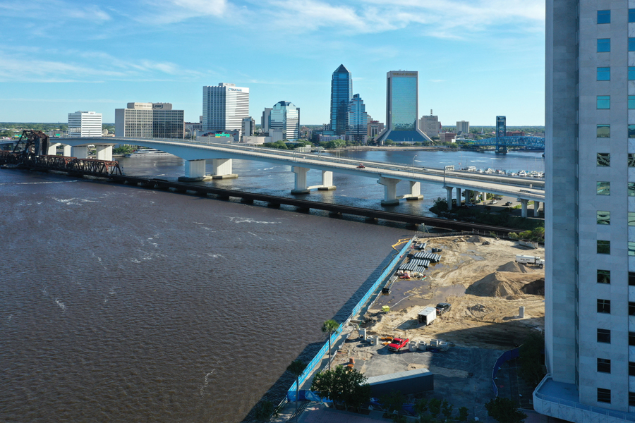 Sunny day view of river and bridge