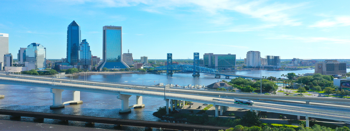 View of bridges and high-rise buildings of Downtown Jacksonville from the Southbank