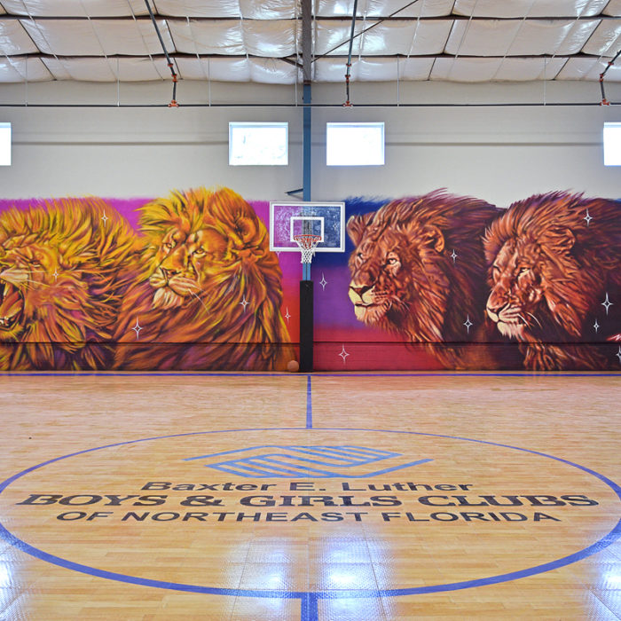 Boys and Girls Club gymnasium with mural