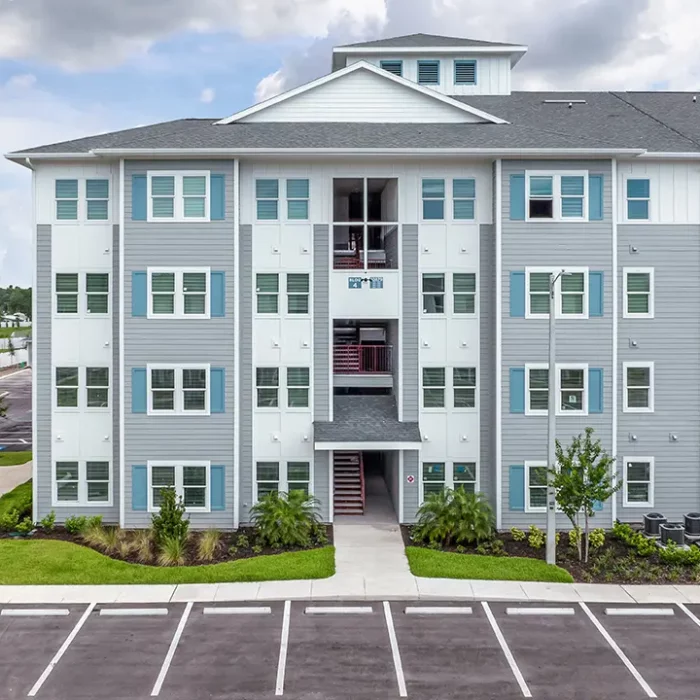 4 story apartment building with a open breezeway stairwell