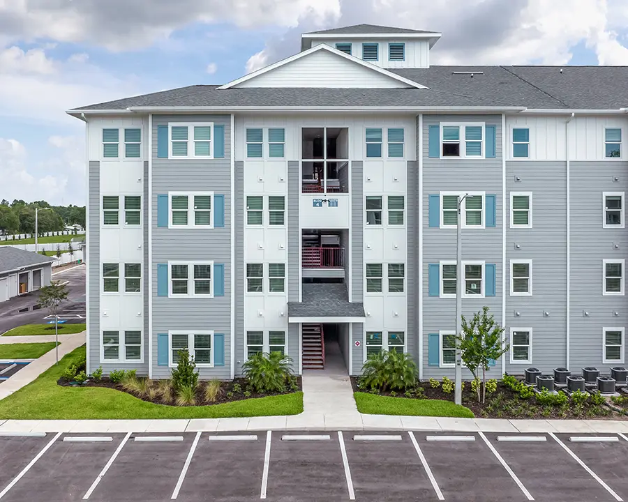 4 story apartment building with a open breezeway stairwell