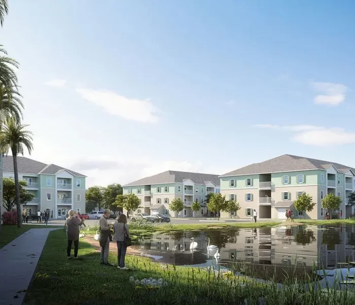 architect's rendering of apartment community with a lake path and 3-story buildings