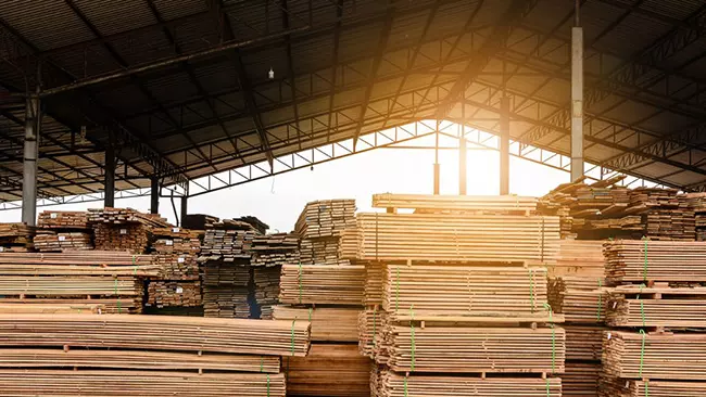 lumber stacked in storage building
