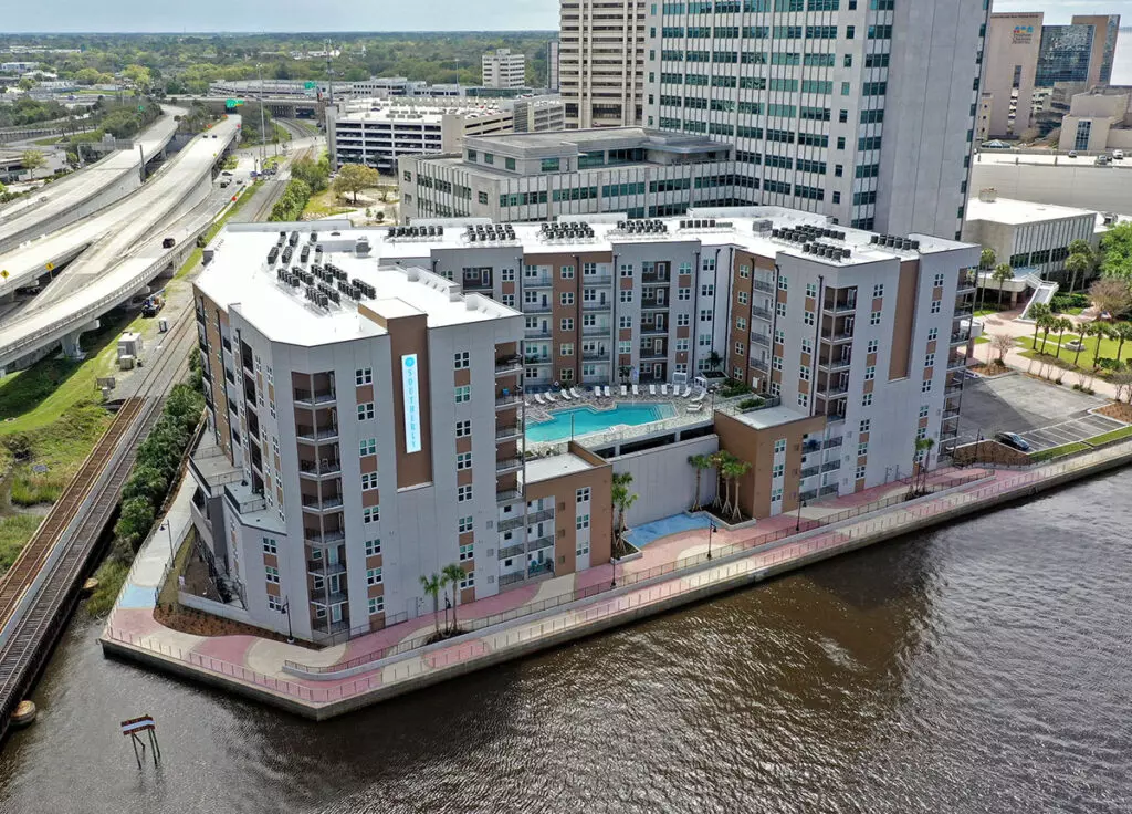aerial view of the Southerly Southbank apartment building with riverwalk in front