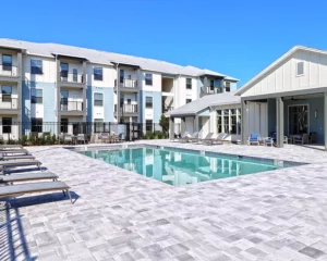 Pool with 3 story apartment building