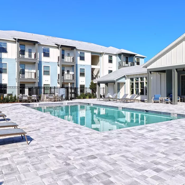 Pool with 3 story apartment building