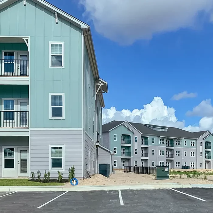 3 story apartment buildings with balconies