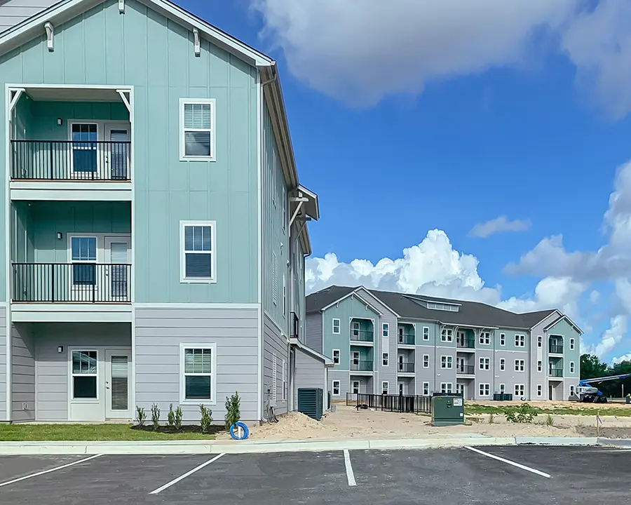 3 story apartment buildings with balconies