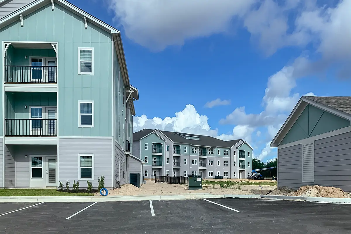3 story apartment buildings with balconies