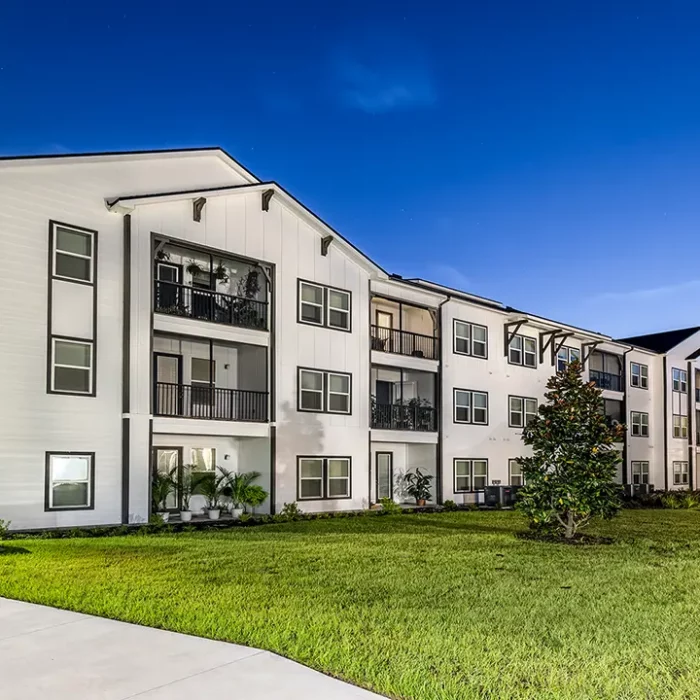 3 story apartment building at night