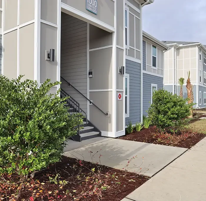 stair and breezeway entrance to an apartment building