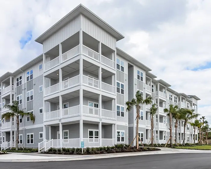 4 story apartment building with balconies