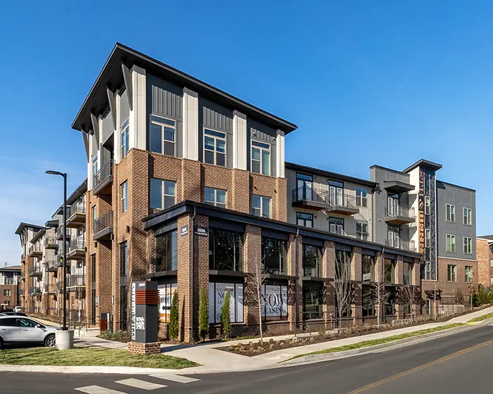 apartment building with brick exterior and lots of windows