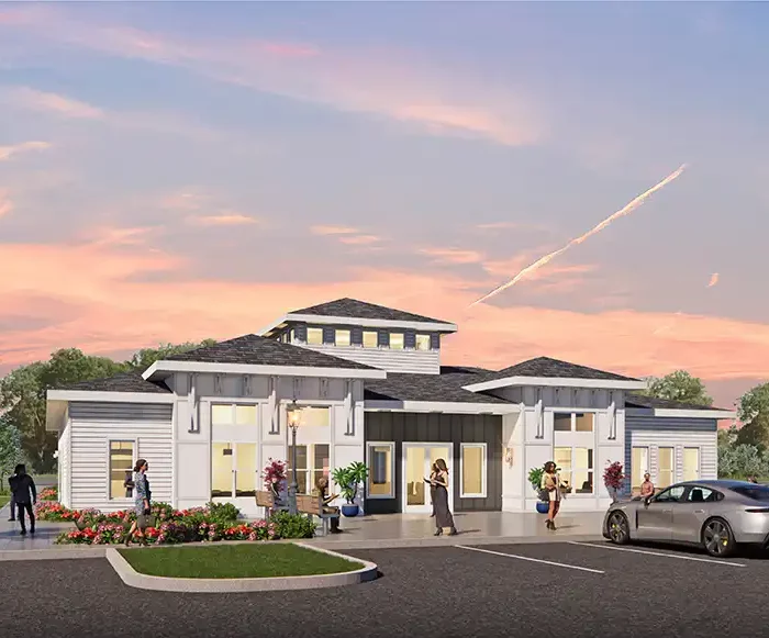 rendering of multifamily clubhouse with cars and people