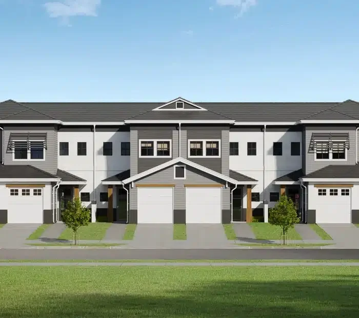 architect's rendering of a 2 story townhouse building with a garage on the first floor